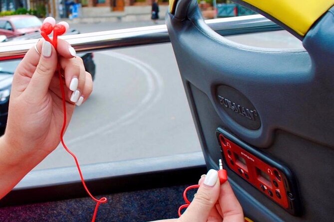 City tour Tbilisi on red bus - Onboard setup: double-decker views and included headsets