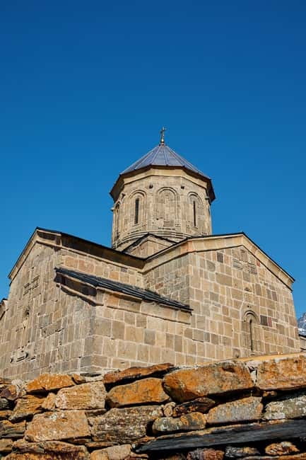 From Tbilisi: Ananuri, Gudauri, and Kazbegi Tour with Guide - Gergeti Trinity Church and the optional jeep ride for a closer Kazbegi view
