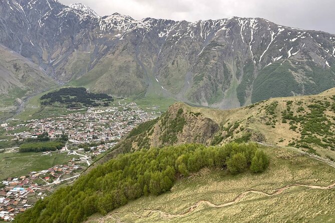 Kazbegi.All inclusive tour in Caucasus mountains - Gudauri ski resort stop: mountains with a ski-town vibe