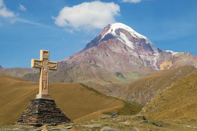 Kazbegi Day trip - Stop 5: Gergeti Trinity Church at 2200 meters, Kazbegi as the backdrop