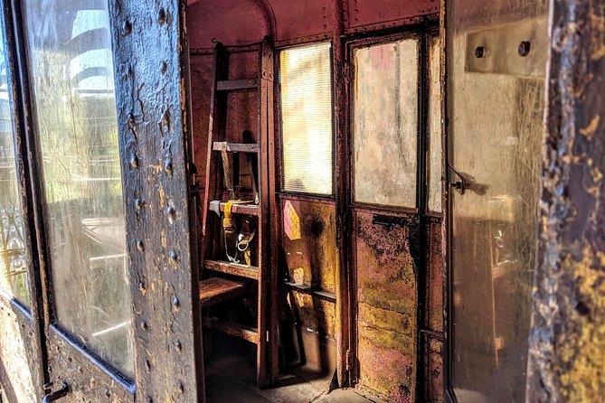 Soviet past - Private day tour to Chiatura, Katskhi pillar and Chronicles - Mgvimevi cave monastery: stair steps, cave air, and a dress check