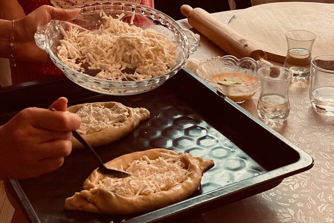 Taste of Georgia. Cooking-Class Khinkali, Khachapuri and more - Adjarian khachapuri next: tender dough, stretchy cheese, and egg yolk