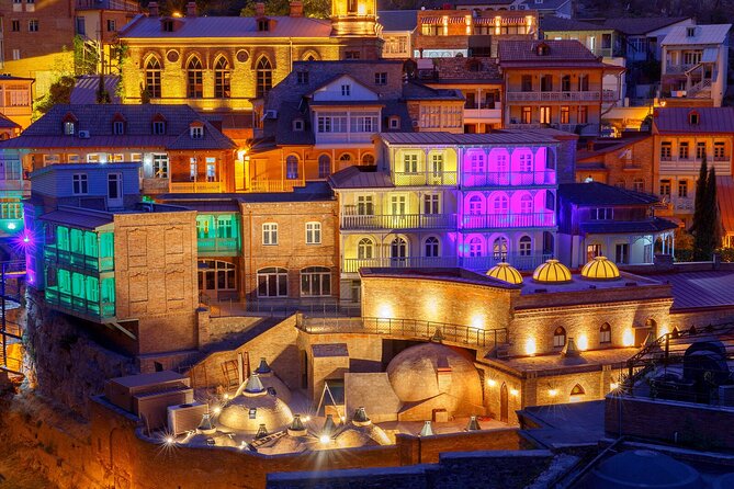 Tbilisi:Evening Walking & Talking Tour with Wine & Boat Ride - Rustaveli Avenue and Liberty Square: the grand boulevard moment