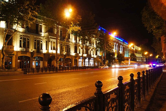 Tbilisi:Evening Walking & Talking Tour with Wine & Boat Ride - The clock angel at Rezo Gabriadze Marionette Theater