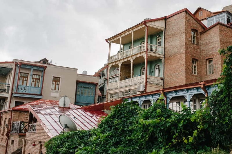 Tbilisi: Guided Walking Tour, Must See & Taste (All-Incl.) - Parliament views and Dry Bridge Market time: state power meets local trading