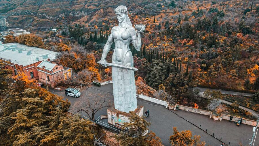 Tbilisi: Old and New City Guided Tour with 2 Cable Car Rides - Old Town streets: Anchiskhati Basilica, the Clock Tower, and theater sights