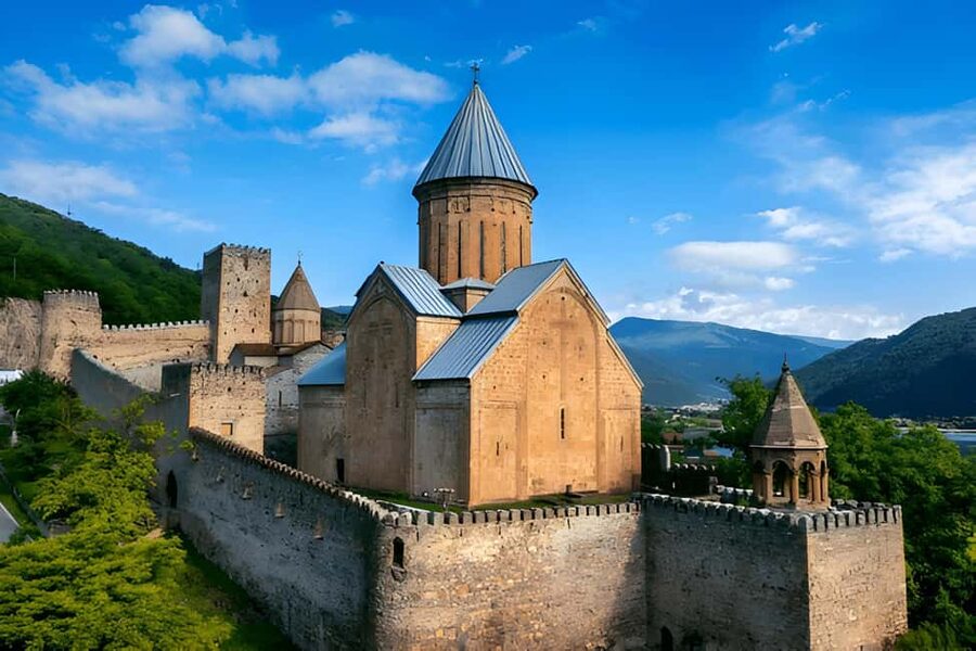Tbilisi to Kazbegi Gudauri Ananuri Zhinvali Group GuidedTour - Gudauri viewpoints: the Russia-Georgia Friendship Monument moment