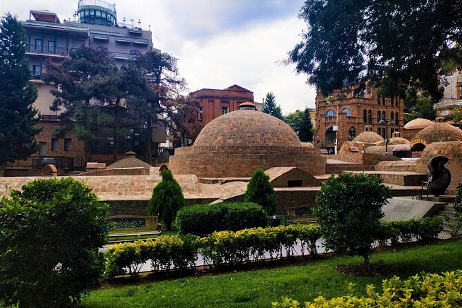 Tbilisi Walking Tour with Cable Car, Wine Tasting & Bread Bite - Rezo Gabriadze Marionette Theater and the Bridge of Peace finish