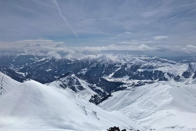 Tour to Kazbegi Ananuri Zhinvali Gudauri Full Day - Gudauri ski resort at altitude: cable cars, lift stations, and big air views